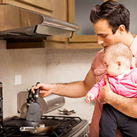 Holding baby in the kitchen